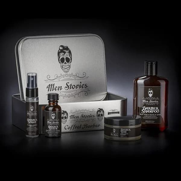 Coffret Barber Men Stories : boîte en métal, shampoing, sérum, spray et cire, sur fond noir